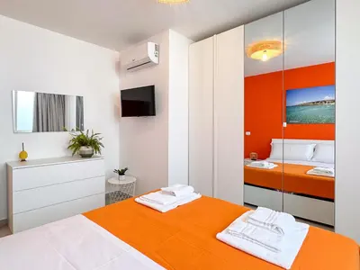 Letto o letti in una camera di Holiday Houses San Lorenzo Calamosche