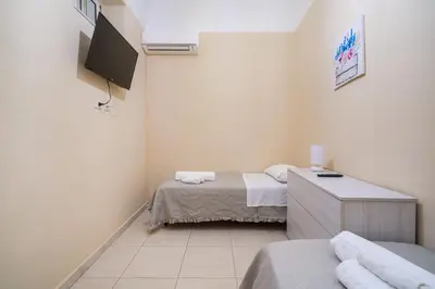 Letto o letti in una camera di VM Apartment