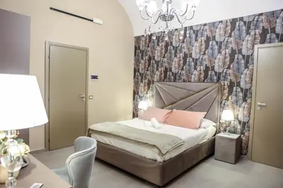 Letto o letti in una camera di B&B Suites&Rooms piazza dei martiri