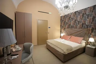 Letto o letti in una camera di B&B Suites&Rooms piazza dei martiri
