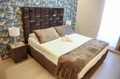 Letto o letti in una camera di B&B Suites&Rooms piazza dei martiri