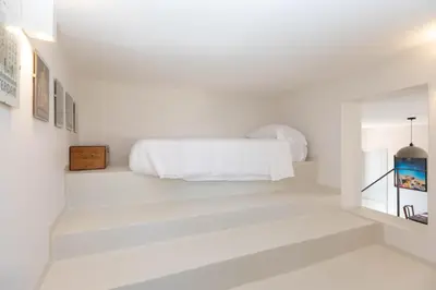 Letto o letti in una camera di Ortigia Terrazza Su Due Mari by Ortigia Apartm...