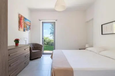 Letto o letti in una camera di Villa Pettegola Tenuta il Cavaliere di Italia Noto- Vista Mare Mini piscina idromassaggio
