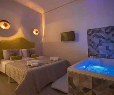 Letto o letti in una camera di Essenza Suite Siracusa con Jacuzzi privata