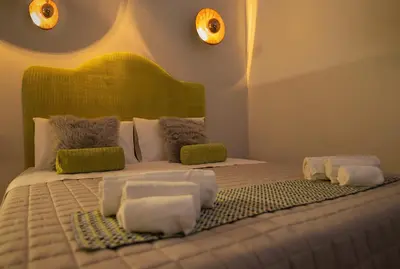 Letto o letti in una camera di Essenza Suite Siracusa con Jacuzzi privata
