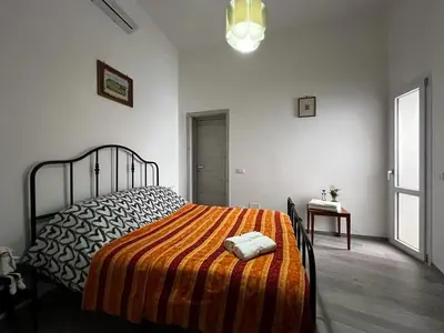 Letto o letti in una camera di Casa O Sole mio