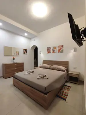 Letto o letti in una camera di Casa Gina