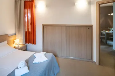 Letto o letti in una camera di RESIDENCE ARCHIMEDE