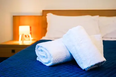 Letto o letti in una camera di RESIDENCE ARCHIMEDE