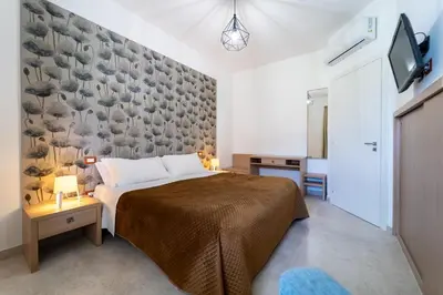 Letto o letti in una camera di RESIDENCE ARCHIMEDE