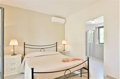 Letto o letti in una camera di Villa Papeda-Tenuta il Cavaliere d'Italia Noto-vista fronte mare e piscina privata