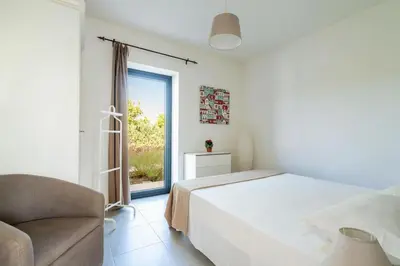Letto o letti in una camera di Villa Papeda-Tenuta il Cavaliere d'Italia Noto-vista fronte mare e piscina privata