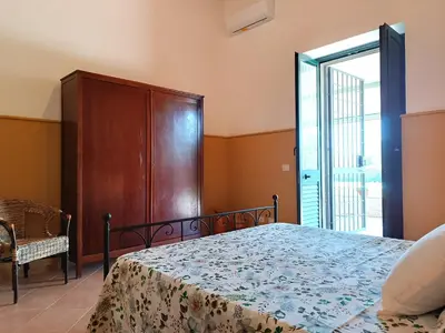 Letto o letti in una camera di Casa Daniela