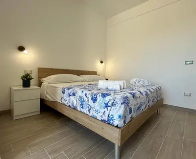 Letto o letti in una camera di Blue Space 50 meters from the sandy beach, parking & wifi