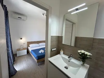 Letto o letti in una camera di Blue Space 50 meters from the sandy beach, parking & wifi