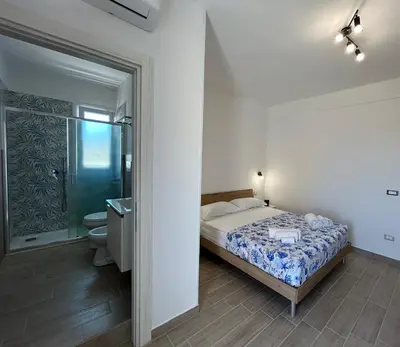 Letto o letti in una camera di Blue Space 50 meters from the sandy beach, parking & wifi