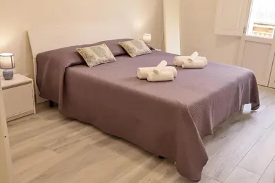 Letto o letti in una camera di Don Camillo Maison