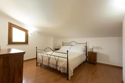 Letto o letti in una camera di Villa Calaforno