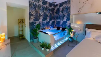Letto o letti in una camera di MAZZINI LUXURY JACUZZY SUITE Catania