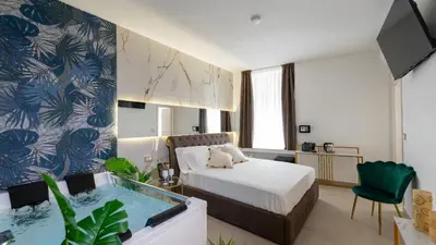 Letto o letti in una camera di MAZZINI LUXURY JACUZZY SUITE Catania