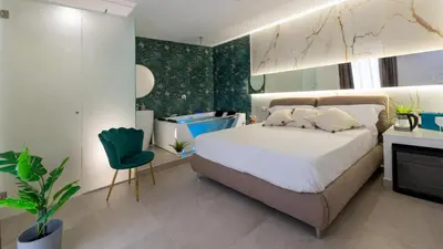 Letto o letti in una camera di MAZZINI LUXURY JACUZZY SUITE Catania
