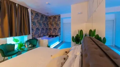 Letto o letti in una camera di MAZZINI LUXURY JACUZZY SUITE Catania