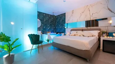 Letto o letti in una camera di MAZZINI LUXURY JACUZZY SUITE Catania