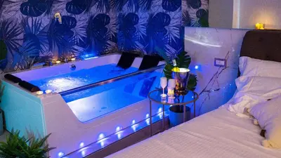 Letto o letti in una camera di MAZZINI LUXURY JACUZZY SUITE Catania