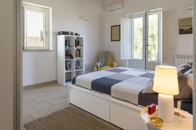 Letto o letti in una camera di Villa Saracena