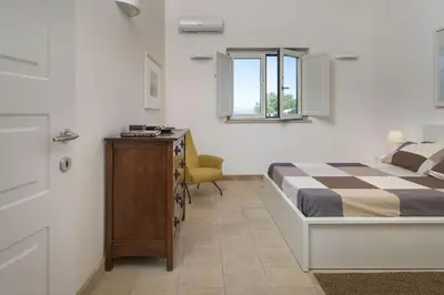 Letto o letti in una camera di Villa Saracena