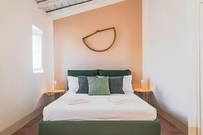 Letto o letti in una camera di Alma Maris Terrazza al Tempio by Bed&Bros