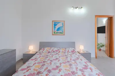 Letto o letti in una camera di Casa Intersimone