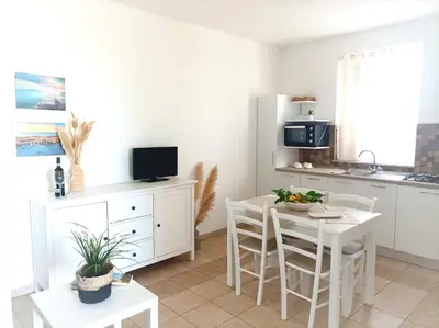 Cucina o angolo cottura di IL MELOGRANO RESIDENCE MARZAMEMI