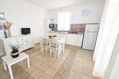 Cucina o angolo cottura di IL MELOGRANO RESIDENCE MARZAMEMI