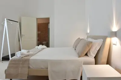 Letto o letti in una camera di Adhoc Rooms