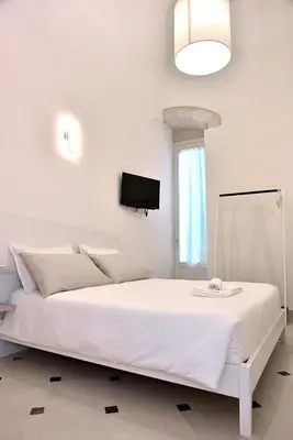 Letto o letti in una camera di Adhoc Rooms