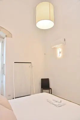 Letto o letti in una camera di Adhoc Rooms