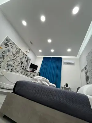 Letto o letti in una camera di Casa Vacanze Happy Moment