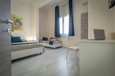 Letto o letti in una camera di San Giuliano Modern Suites