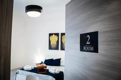 Letto o letti in una camera di San Giuliano Modern Suites