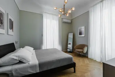 Letto o letti in una camera di Palazzo Bozzanca Apartments by Wonderful Italy