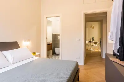 Letto o letti in una camera di Palazzo Bozzanca Apartments by Wonderful Italy
