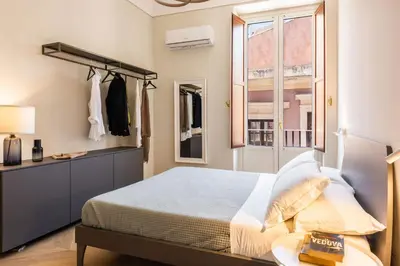 Letto o letti in una camera di Palazzo Bozzanca Apartments by Wonderful Italy