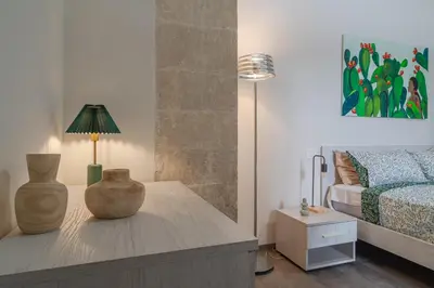 Letto o letti in una camera di Historic building modern touches - Ortigia