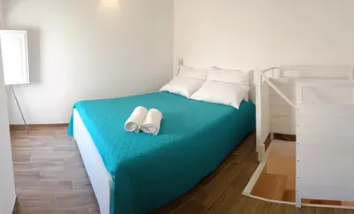 Letto o letti in una camera di Casa Sciabica
