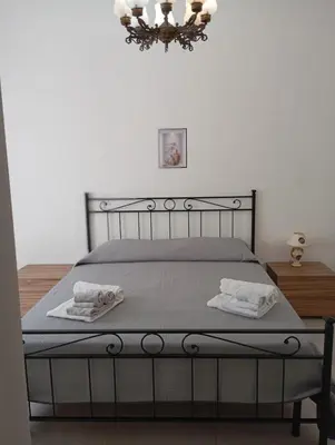 Letto o letti in una camera di Da Adriana