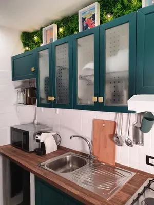 Cucina o angolo cottura di DownSouth Studio Apartment with Mezzanine - Historic Center