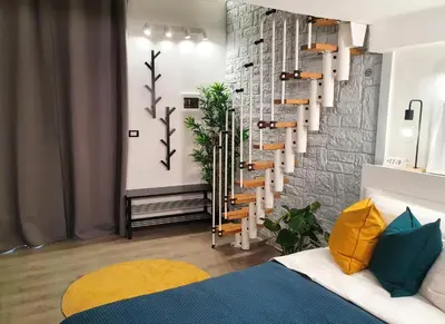 Letto o letti in una camera di DownSouth Studio Apartment with Mezzanine - Historic Center