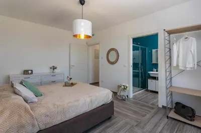 Letto o letti in una camera di Dimora degli Ulivi 10 Emma Villas