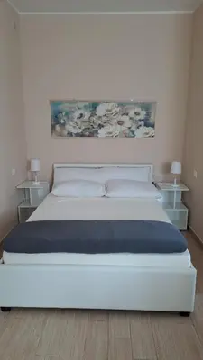 Letto o letti in una camera di Casa carmela